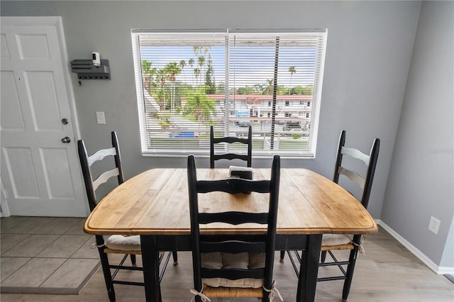 dining space featuring baseboards