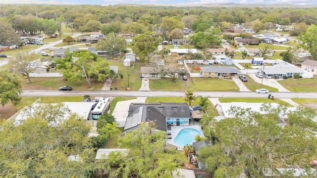 bird's eye view with a forest view and a residential view