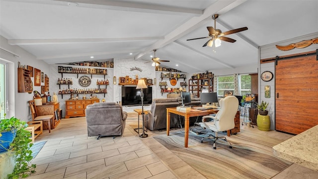 office space featuring ceiling fan, lofted ceiling with beams, a dry bar, and a barn door