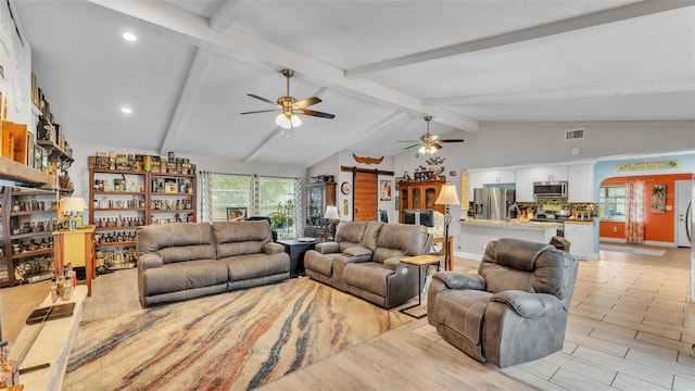 living area featuring visible vents, baseboards, a ceiling fan, lofted ceiling with beams, and light wood-style floors