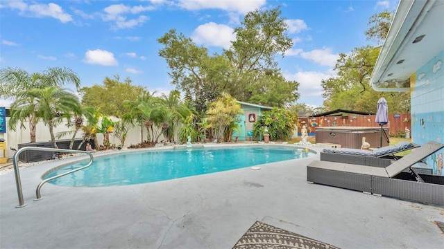 view of swimming pool with a fenced in pool, a patio area, a hot tub, and a fenced backyard