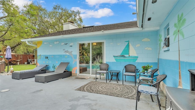 view of patio / terrace featuring fence and an outdoor living space