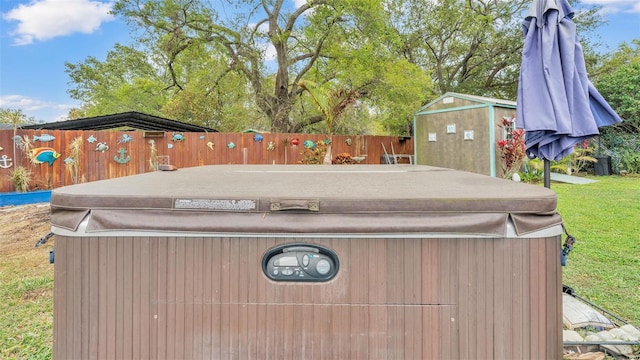 exterior space with a jacuzzi and fence