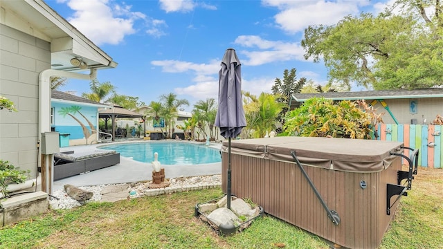 outdoor pool featuring a hot tub, fence, a patio, and a gazebo