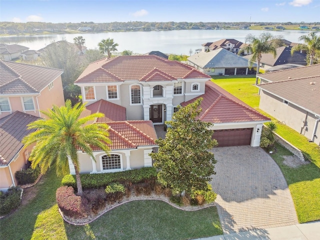 birds eye view of property with a residential view and a water view