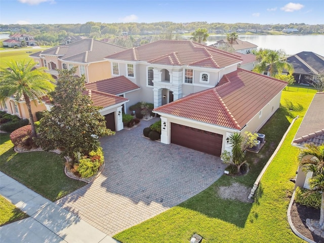 birds eye view of property with a water view and a residential view