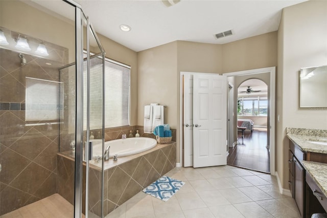 full bath featuring a garden tub, visible vents, a stall shower, vanity, and tile patterned floors