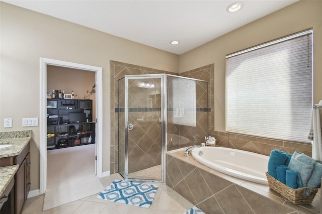 full bathroom with tile patterned floors, a shower stall, a bath, and vanity