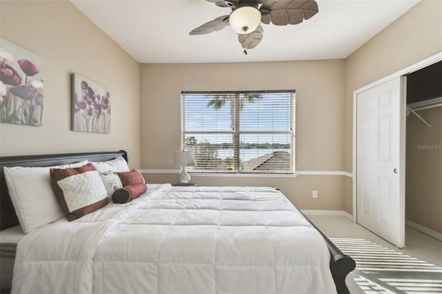 bedroom with carpet floors, baseboards, and a ceiling fan