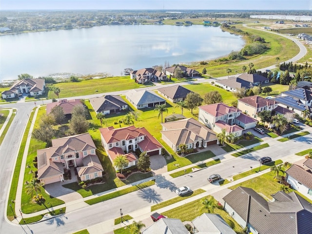 birds eye view of property featuring a water view and a residential view