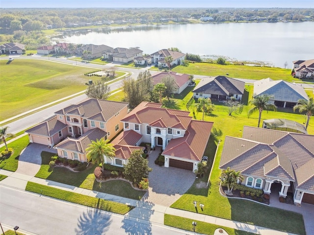 birds eye view of property featuring a water view and a residential view