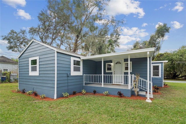 bungalow-style house with a porch and a front yard