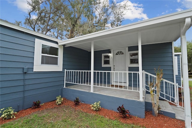 entrance to property featuring covered porch