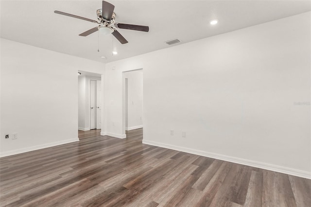 unfurnished room featuring dark wood-style flooring, recessed lighting, visible vents, ceiling fan, and baseboards