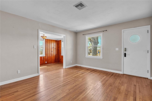 entryway featuring baseboards, visible vents, and light wood-style floors