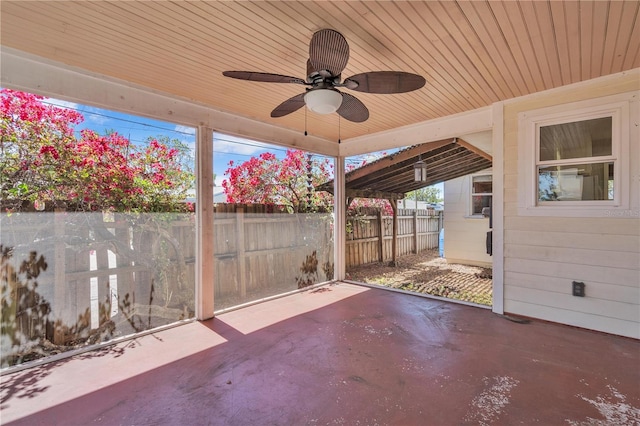 view of patio featuring fence and a ceiling fan