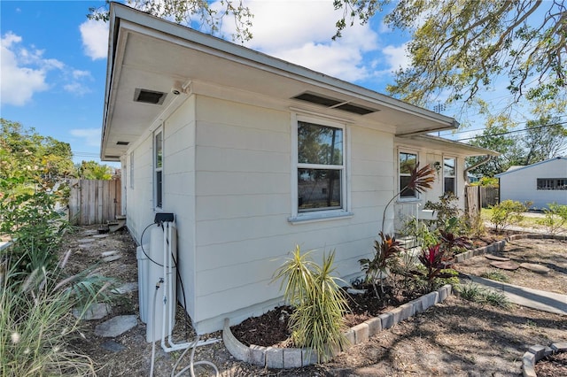 view of side of property with fence