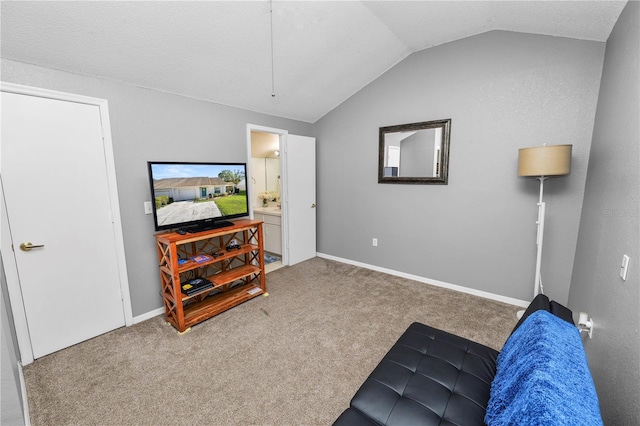 living area featuring lofted ceiling, carpet flooring, and baseboards