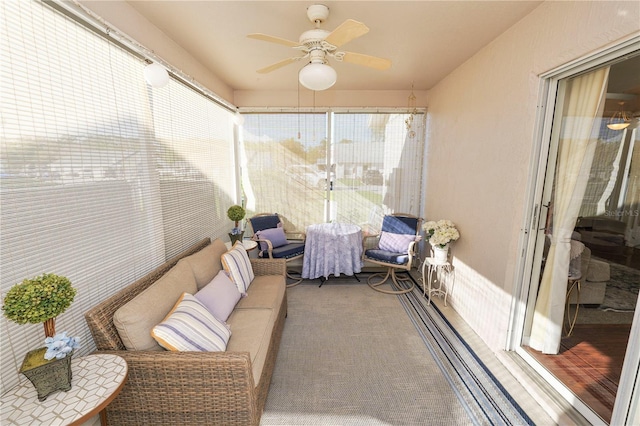 sunroom featuring ceiling fan