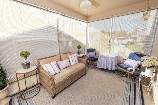 sunroom featuring ceiling fan