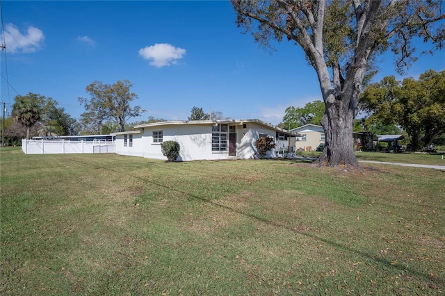 exterior space featuring fence and a yard