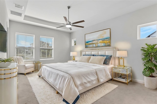 bedroom with baseboards, visible vents, ceiling fan, and carpet flooring