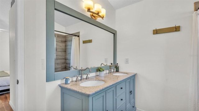 full bathroom with curtained shower, ensuite bath, double vanity, and a sink