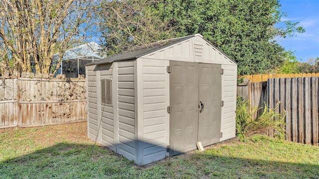 view of shed featuring a fenced backyard