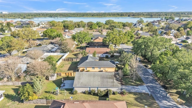 drone / aerial view with a residential view and a water view