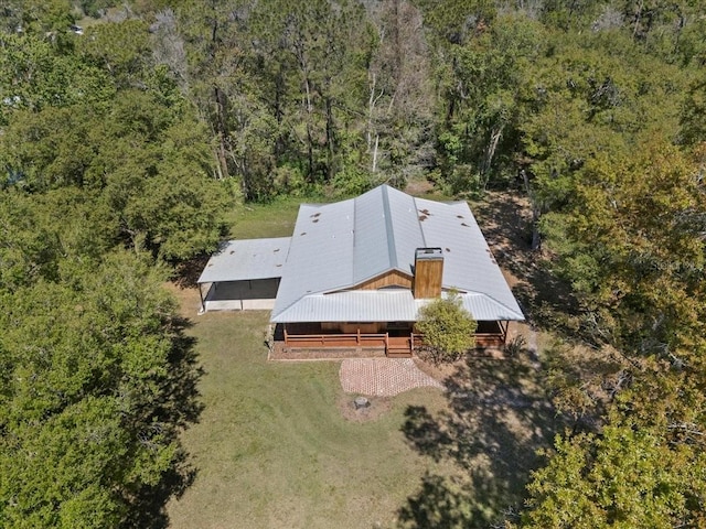 birds eye view of property with a wooded view