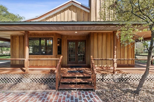 entrance to property with french doors and board and batten siding