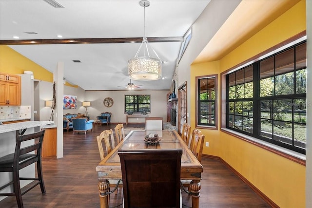 dining room featuring ceiling fan, baseboards, dark wood finished floors, and vaulted ceiling with beams