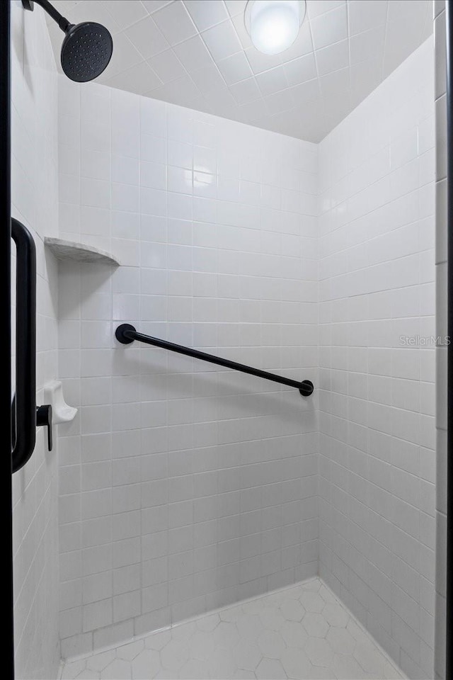 bathroom with a tile shower