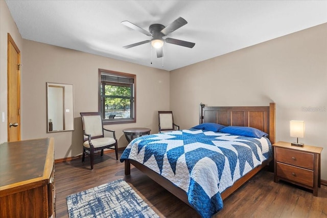 bedroom with a ceiling fan, baseboards, and dark wood-style flooring