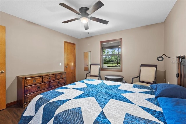 bedroom with wood finished floors, baseboards, and ceiling fan