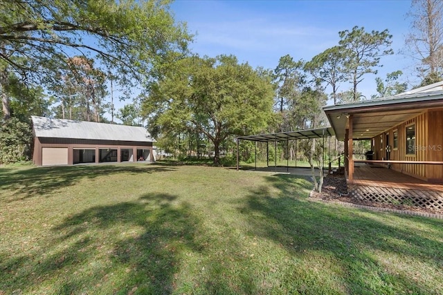 view of yard with an outbuilding and a deck