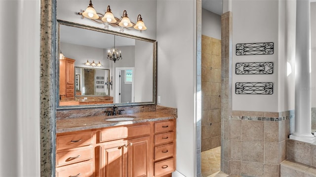 full bathroom featuring vanity and an inviting chandelier