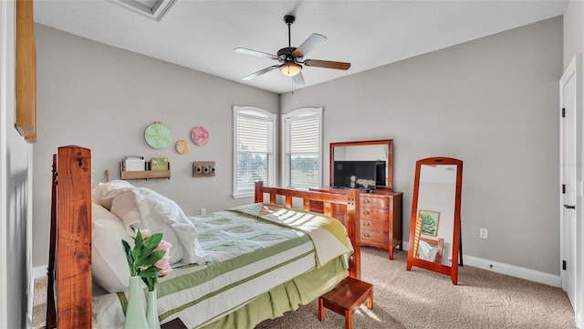 bedroom with carpet flooring, a ceiling fan, and baseboards