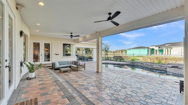 view of patio with a ceiling fan, a fenced in pool, a fenced backyard, french doors, and outdoor lounge area