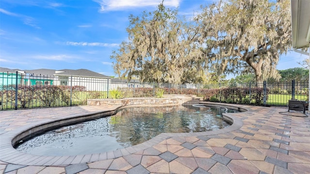 view of swimming pool featuring a fenced in pool, a patio, and fence