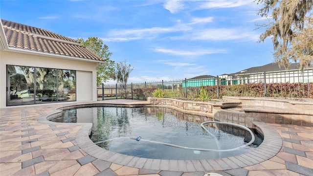 view of swimming pool featuring a patio and a fenced backyard