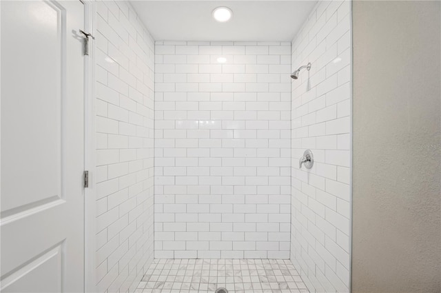 full bathroom with tiled shower