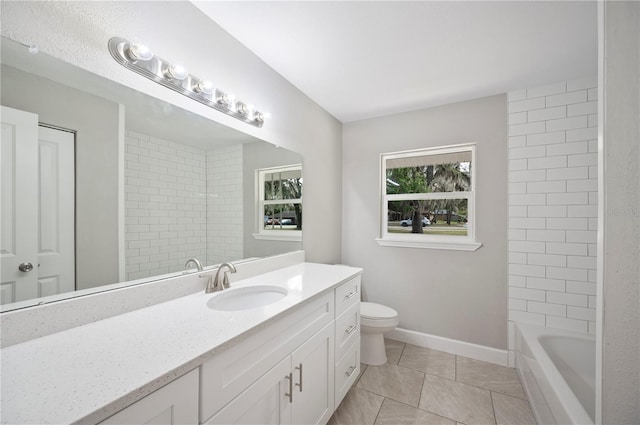 bathroom with tile patterned floors, baseboards, toilet, and vanity