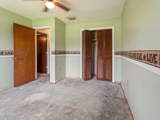 unfurnished bedroom with unfinished concrete floors, visible vents, a closet, and a textured ceiling