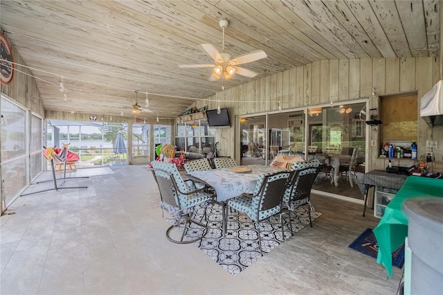 dining area with lofted ceiling, wood ceiling, and a ceiling fan