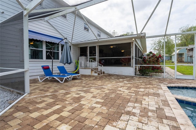 exterior space with glass enclosure and a sunroom