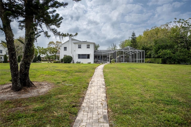 view of yard featuring glass enclosure