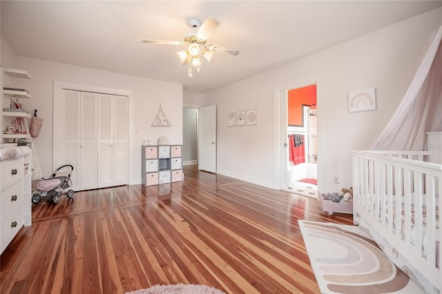 bedroom featuring a closet, a ceiling fan, and wood finished floors