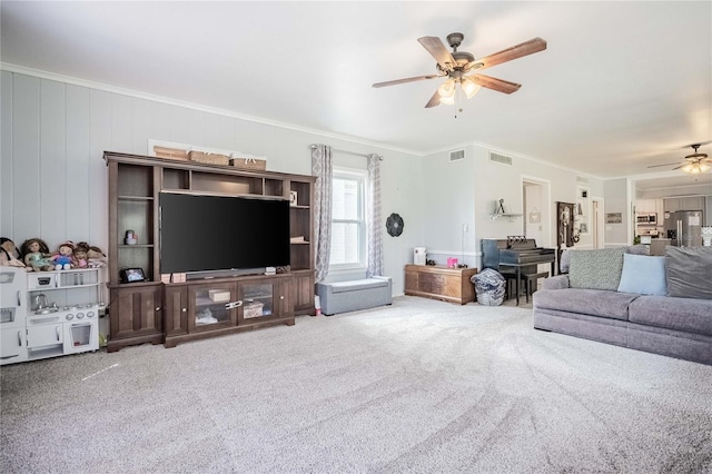 112 E Graham Park Dr, Haines City, FL 33844 - carpeted living area with ceiling fan and crown molding
