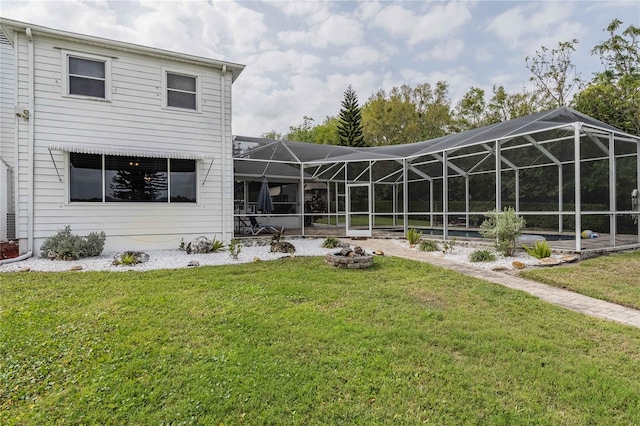 112 E Graham Park Dr, Haines City, FL 33844 - rear view of property featuring a yard and a lanai